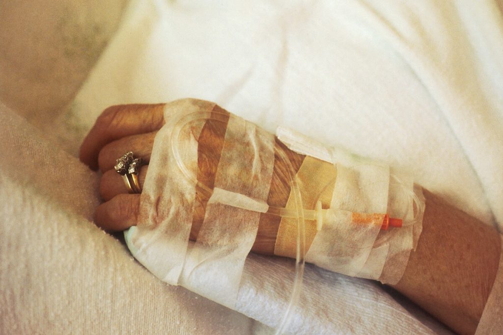 close up of an elderly woman's hand with IV 