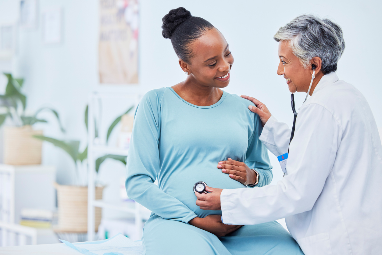 A prenatal doctor performing a check-up on an expectant mother.